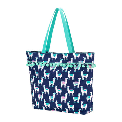 Navy llama tote with mint handles and fringe on a white background