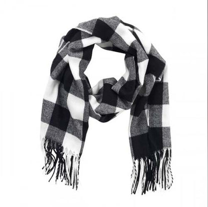 Black and white buffalo check scarf with fringed ends, looped on a white background.