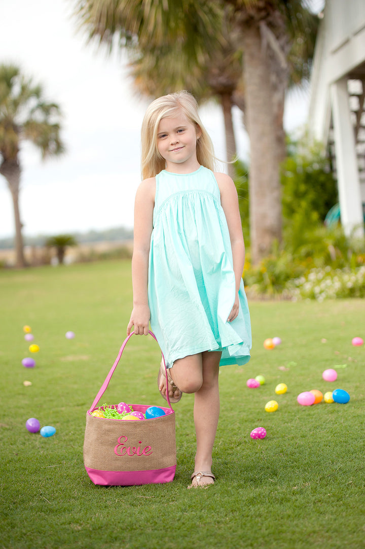 girl with pink burlap Easter baskets