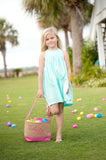 girl with pink burlap Easter baskets