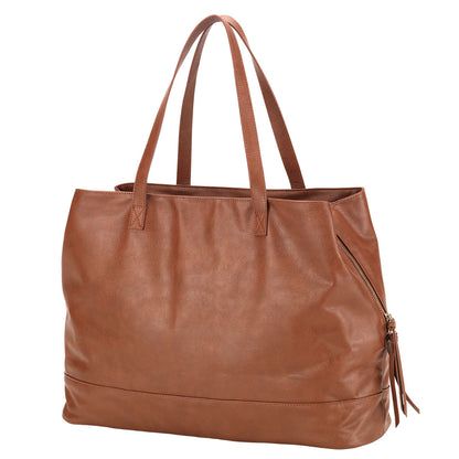 Camel Cambridge travel tote with long handles on a white background