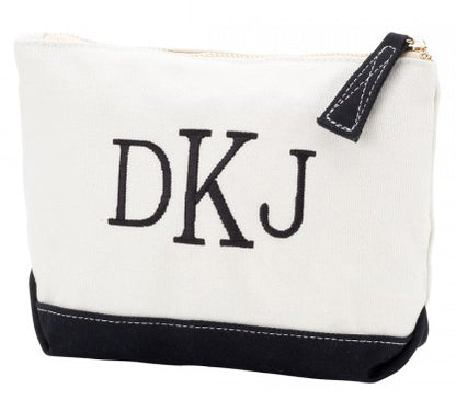 Cream accessory pouch with black base and large black initials
