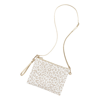 Cream leopard-print bag with its long crossbody strap extended
