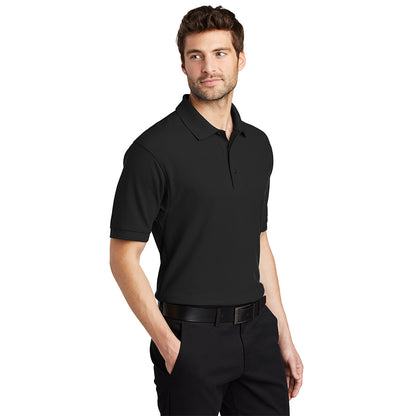 Man wearing a black short-sleeve polo shirt with a collar and button placket.