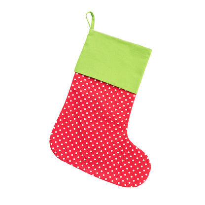 Red Christmas stocking with small white dots and green cuff on white