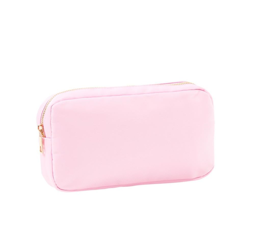 Pink zippered accessory pouch on a white background